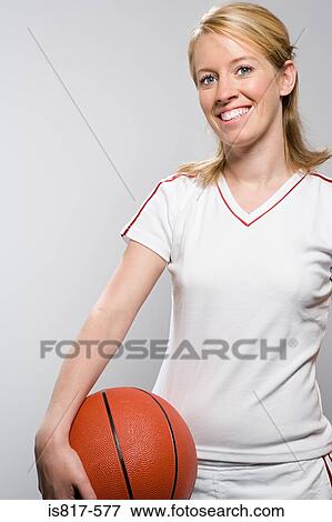 Basketballplayer holding basketball View Large Photo Image Stock Photo - Basketballplayer holding basketball. Fotosearch