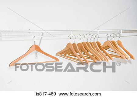 Clothes hangers on a clothes rail View Large Photo Image Stock Photo - Clothes hangers on a clothes rail. Fotosearch