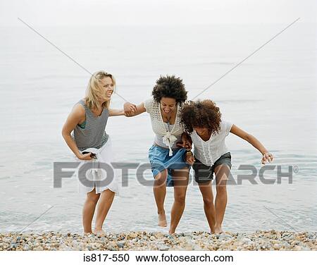 Friends at the beach View Large Photo Image Stock Image - Friends at the beach. Fotosearch