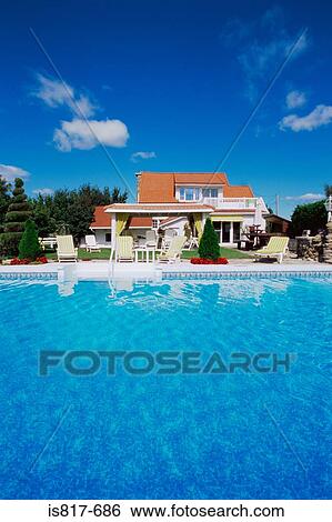 Stock Photograph - House with a swimming pool. Fotosearch
