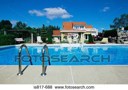 Luxury house with a swimming pool View Large Photo Image Stock Photo - Luxury house with a swimming pool. Fotosearch