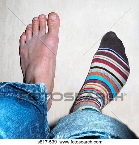 Person wearing one sock View Large Photo Image Stock Photo - Person wearing one sock. Fotosearch