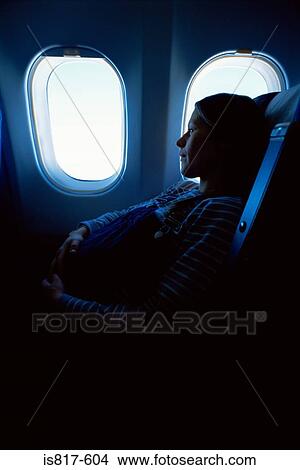 Pregnant woman on an aeroplane View Large Photo Image Picture - Pregnant woman on an aeroplane. Fotosearch