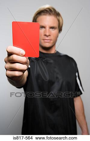 Picture - Referee holding red card. Fotosearch