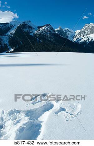 Stock Image - Snow angel on emerald lake. Fotosearch