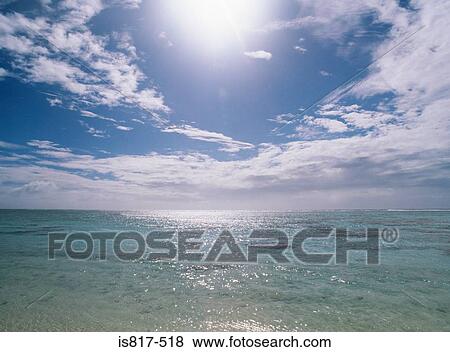 Stock Photo - Sun shining on the sea. Fotosearch