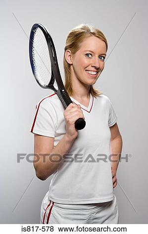 Tennis player holding tennis racket View Large Photo Image Stock Photo - Tennis player holding tennis racket. Fotosearch