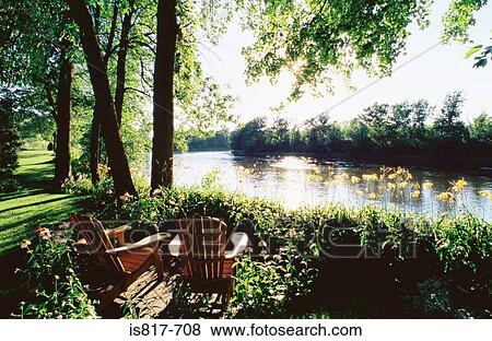 Two chairs near river View Large Photo Image Stock Photo - Two chairs near river. Fotosearch