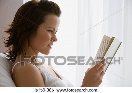Woman reading a book View Large Photo Image Stock Photography - Woman reading a book. Fotosearch