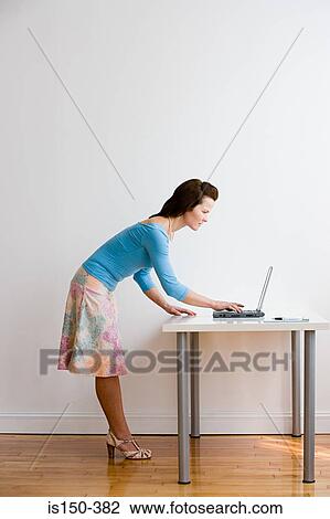 Woman using laptop View Large Photo Image Stock Image - Woman using laptop. Fotosearch