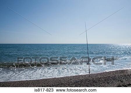 Fishing rod on a beach View Large Photo Image Stock Image - Fishing rod on a beach. Fotosearch