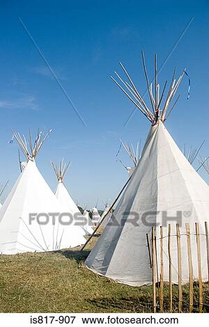 Teepees in a field View Large Photo Image Stock Photo - Teepees in a field. Fotosearch