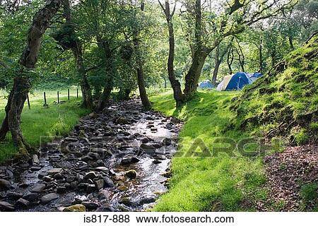 Tents by a stream View Large Photo Image Stock Photo - Tents by a stream. Fotosearch