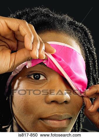Woman lifting eye mask View Large Photo Image Stock Image - Woman lifting eye mask. Fotosearch