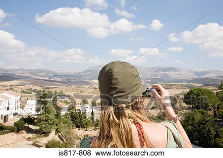 Woman taking a picture of ronda landscape View Large Photo Image Stock Photo - Woman taking a picture of ronda landscape. Fotosearch