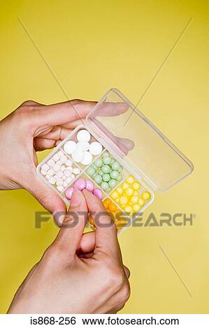 Person with box of tablets View Large Photo Image Stock Photograph - Person with box of tablets. Fotosearch