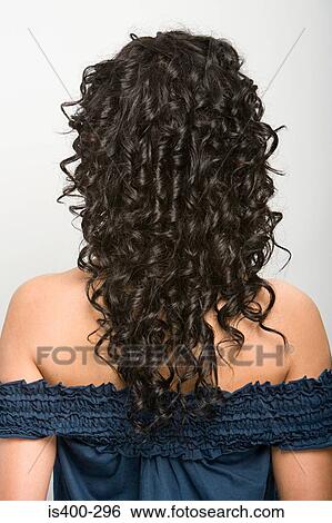 Stock Photograph - Rear view of a young woman. Fotosearch