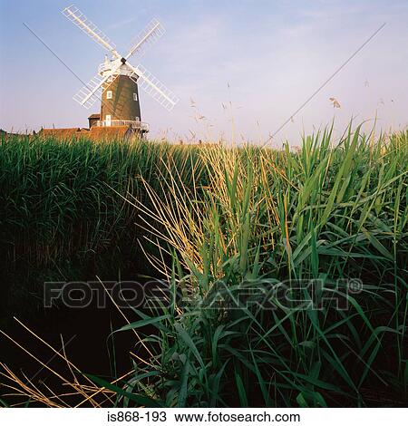 Stock Image - Windmill in the countryside. Fotosearch