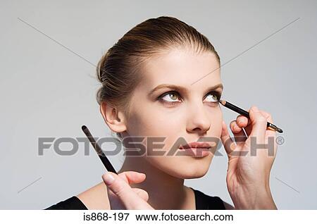 Woman having make up applied View Large Photo Image Stock Photo - Woman having make up applied. Fotosearch