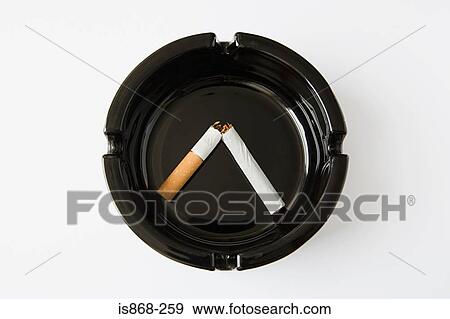 Broken cigarette in ashtray View Large Photo Image Stock Photo - Broken cigarette in ashtray. Fotosearch