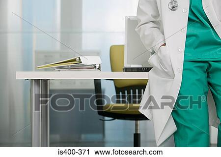 Doctor in their office View Large Photo Image Stock Image - Doctor in their office. Fotosearch