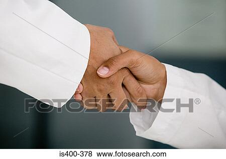 Doctors shaking hands View Large Photo Image Stock Photo - Doctors shaking hands. Fotosearch