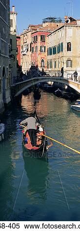 People riding a gondola in venice View Large Photo Image Stock Photography - People riding a gondola in venice. Fotosearch