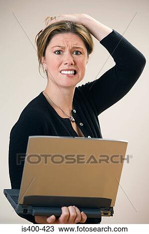 Stressed woman with laptop View Large Photo Image Stock Image - Stressed woman with laptop. Fotosearch