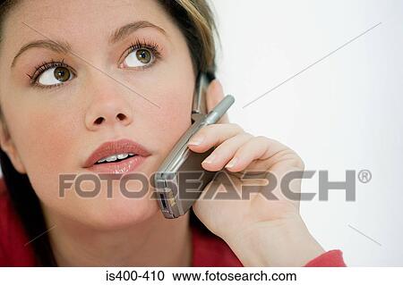 Stock Image - Woman on cellphone. Fotosearch