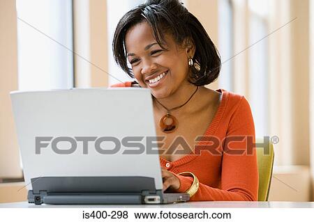 Woman using laptop View Large Photo Image Stock Photo - Woman using laptop. Fotosearch