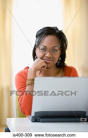 Woman with a laptop View Large Photo Image Stock Photo - Woman with a laptop. Fotosearch