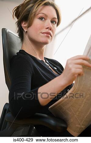Woman with newspaper View Large Photo Image Stock Photo - Woman with newspaper. Fotosearch