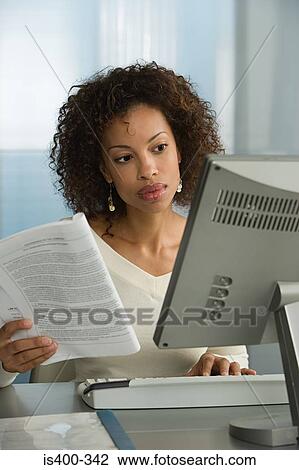 Stock Image - Woman working. Fotosearch