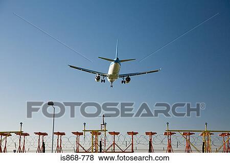 Aeroplane coming in to land View Large Photo Image Stock Photo - Aeroplane coming in to land. Fotosearch