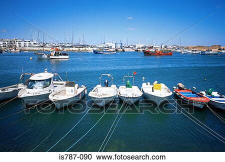 Boats in a row View Large Photo Image Stock Image - Boats in a row. Fotosearch