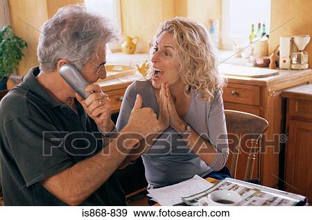 Couple getting good news View Large Photo Image Stock Photo - Couple getting good news. Fotosearch