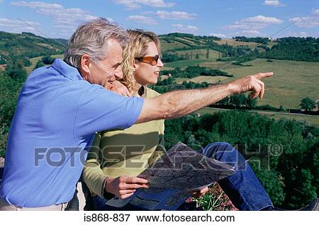 Couple in field View Large Photo Image Stock Photo - Couple in field. Fotosearch