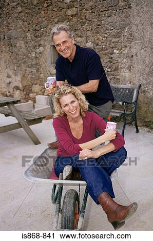 Couple taking a break from building work View Large Photo Image Stock Image - Couple taking a break from building work. Fotosearch