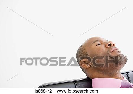 Stock Image - Office worker sleeping. Fotosearch