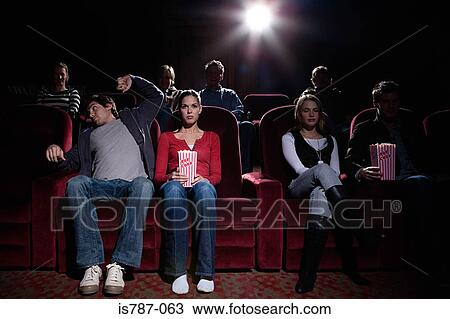 Stock Image - People at the cinema. Fotosearch