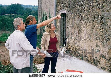 People looking at house wall View Large Photo Image Stock Photo - People looking at house wall. Fotosearch
