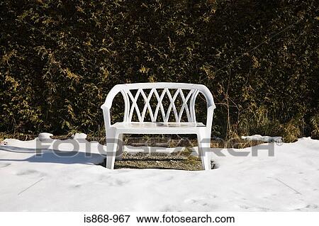 Stock Photo - Plastic chair in garden. Fotosearch