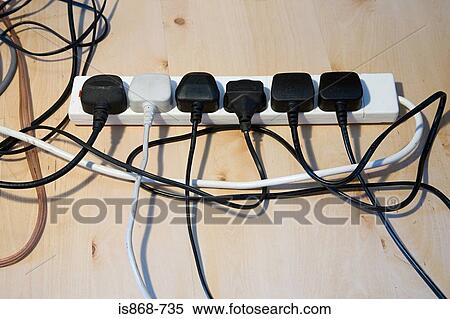 Stock Photography - Plugs in an extension cable. Fotosearch