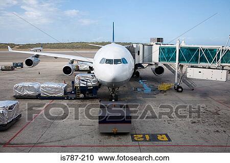Stock Image - Preparing airplane. Fotosearch