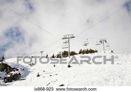 Skiers on ski lift View Large Photo Image Stock Image - Skiers on ski lift. Fotosearch