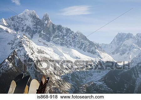 Skis and snow covered mountains View Large Photo Image Stock Photo - Skis and snow covered mountains. Fotosearch