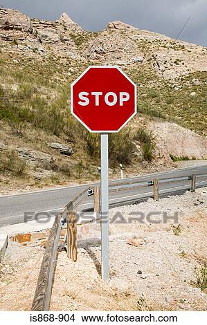 Stop sign near road View Large Photo Image Picture - Stop sign near road. Fotosearch
