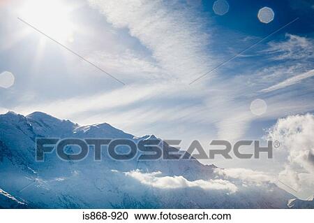 Sunlight over the french alps View Large Photo Image Stock Image - Sunlight over the french alps. Fotosearch