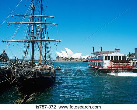 Stock Image - Boats and sydney opera house. Fotosearch