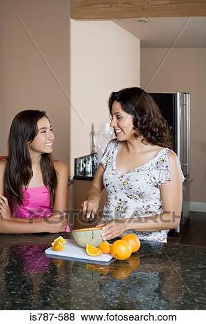 Mother and daughter in kitchen View Large Photo Image Stock Photo - Mother and daughter in kitchen. Fotosearch